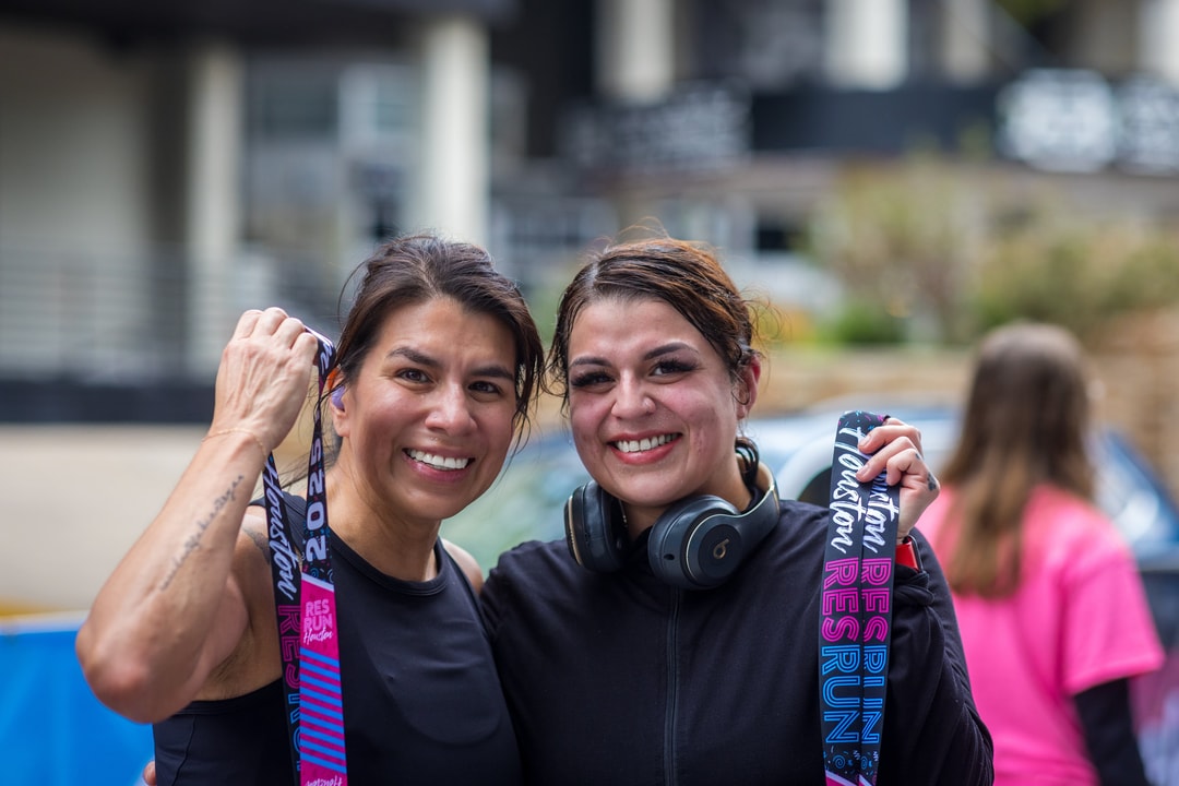 Two finishers with their medals after an NSP event